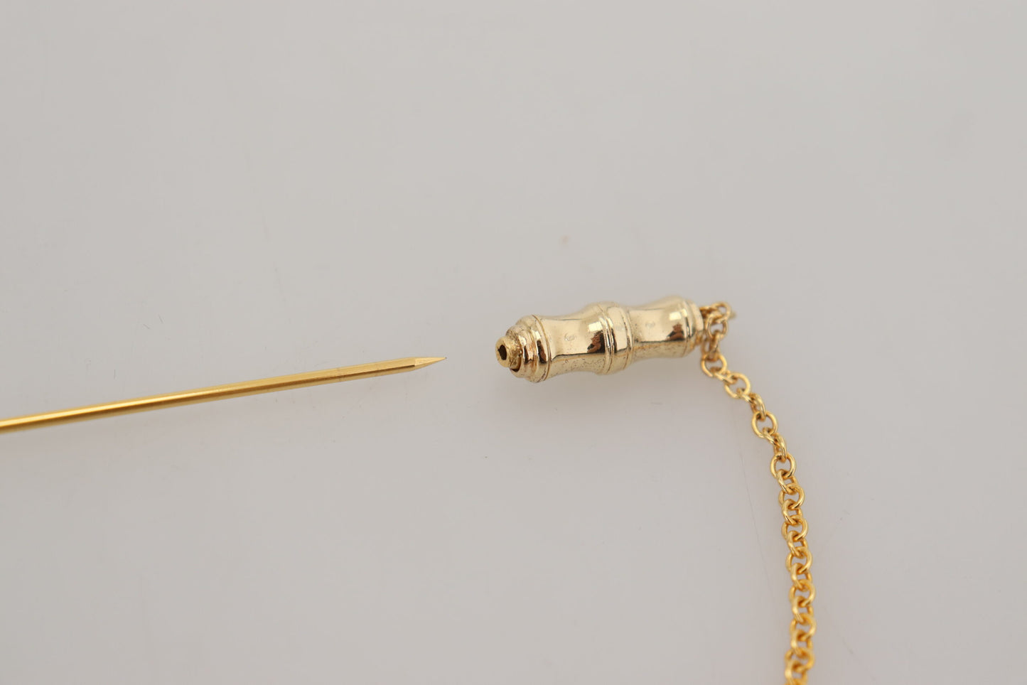 Dolce & Gabbana Elegant Gold-Toned Silver Brooch Pin